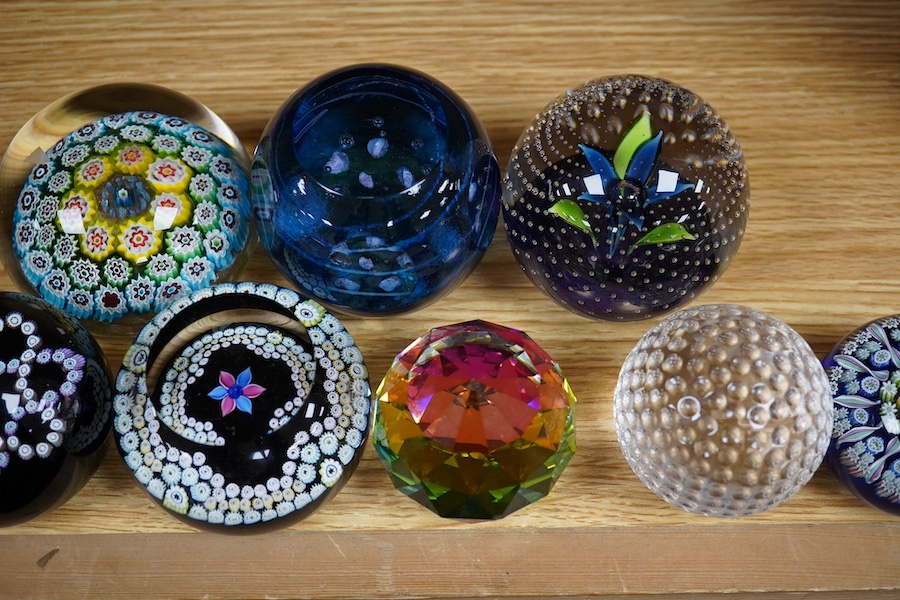 A group of paperweights to include Waterford, Caithness and Edinburgh, largest 8cm in diameter. Condition - fair to good